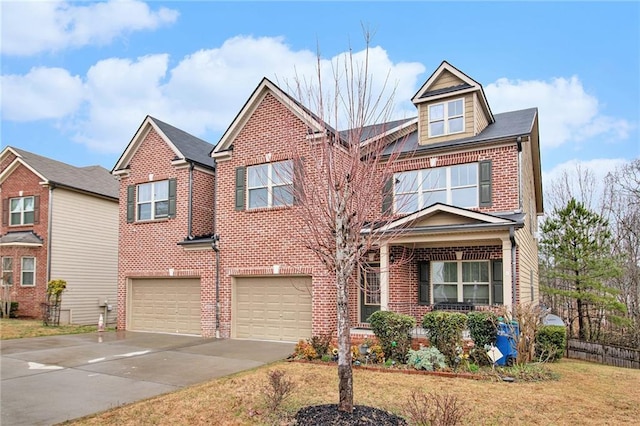 view of front facade with a front lawn, brick siding, an attached garage, and driveway