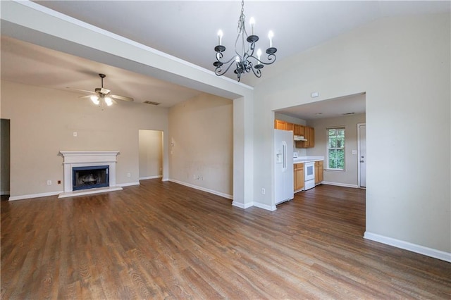 10247 Deep Creek Pl, Union City, GA 30291 - unfurnished living room featuring ceiling fan, dark wood-style flooring, baseboards, a chandelier, and a fireplace with raised hearth