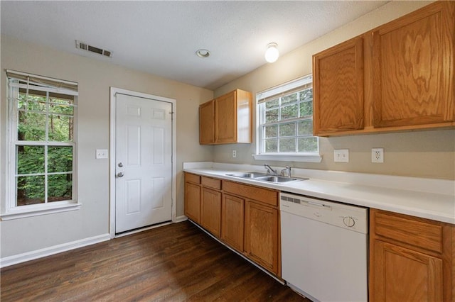 10247 Deep Creek Pl, Union City, GA 30291 - kitchen featuring white dishwasher, a sink, dark wood finished floors, light countertops, and baseboards