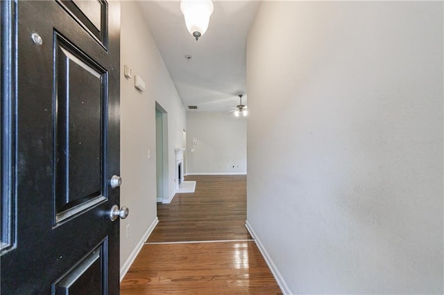 10247 Deep Creek Pl, Union City, GA 30291 - foyer featuring wood finished floors, ceiling fan, and baseboards