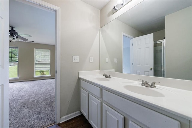 10247 Deep Creek Pl, Union City, GA 30291 - bathroom featuring double vanity, an enclosed shower, a ceiling fan, and baseboards