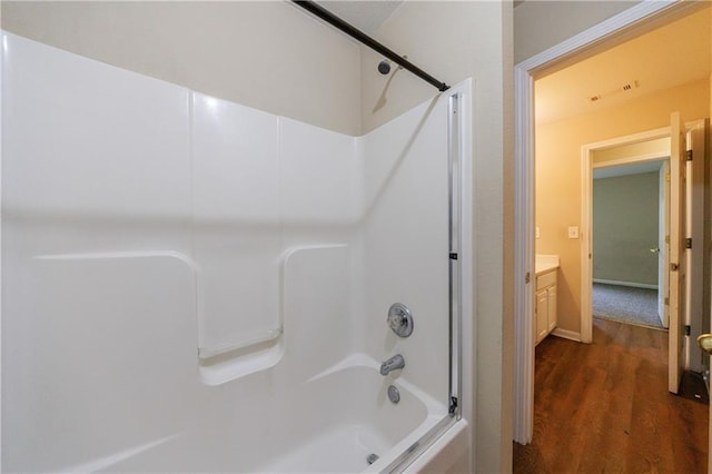 10247 Deep Creek Pl, Union City, GA 30291 - full bathroom featuring wood finished floors,  shower combination, and vanity