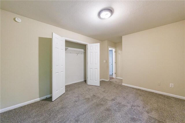 10247 Deep Creek Pl, Union City, GA 30291 - unfurnished bedroom featuring carpet floors, baseboards, a closet, and a textured ceiling