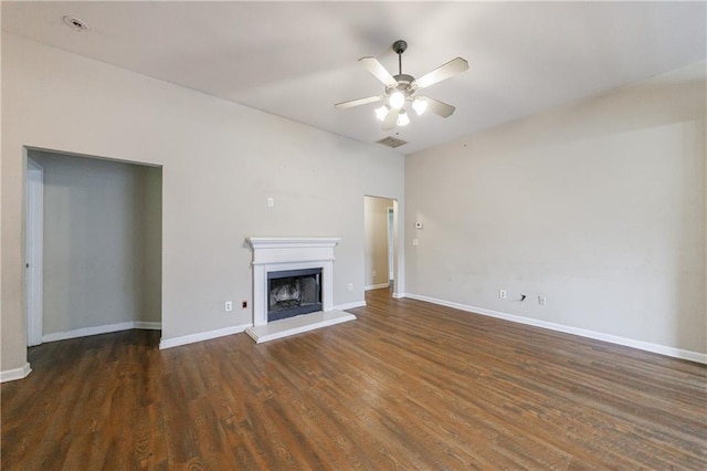10247 Deep Creek Pl, Union City, GA 30291 - unfurnished living room featuring a ceiling fan, wood finished floors, a fireplace with raised hearth, and baseboards