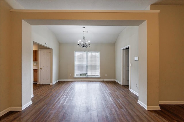 10247 Deep Creek Pl, Union City, GA 30291 - unfurnished dining area with vaulted ceiling, dark wood finished floors, a chandelier, and baseboards