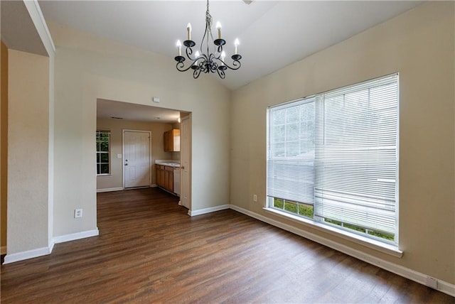 10247 Deep Creek Pl, Union City, GA 30291 - spare room featuring a chandelier, dark wood-style flooring, baseboards, and lofted ceiling