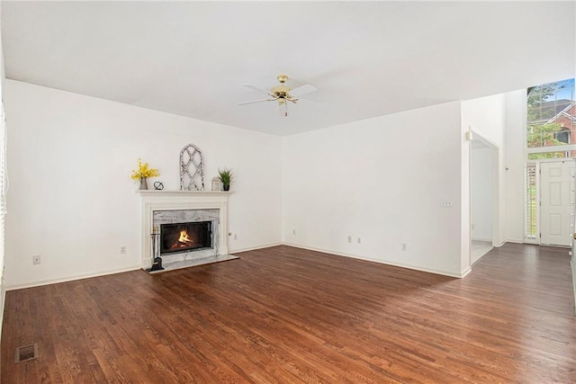 200 Ridge Bluff Ln, Suwanee, GA 30024 - unfurnished living room featuring a ceiling fan, wood finished floors, a high end fireplace, and baseboards