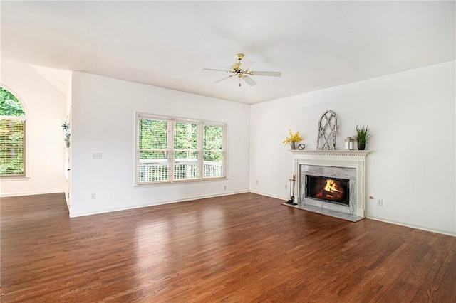 200 Ridge Bluff Ln, Suwanee, GA 30024 - unfurnished living room featuring plenty of natural light, wood finished floors, and a premium fireplace