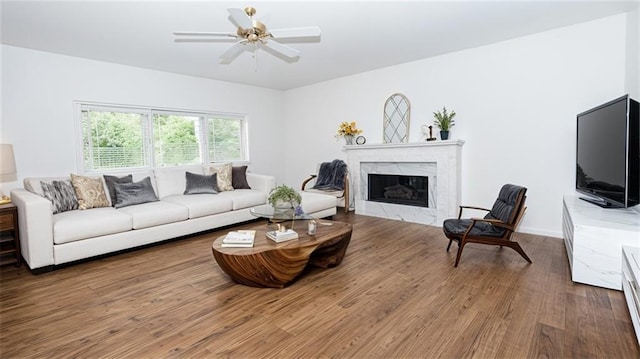 200 Ridge Bluff Ln, Suwanee, GA 30024 - living area featuring wood finished floors, a premium fireplace, and a ceiling fan