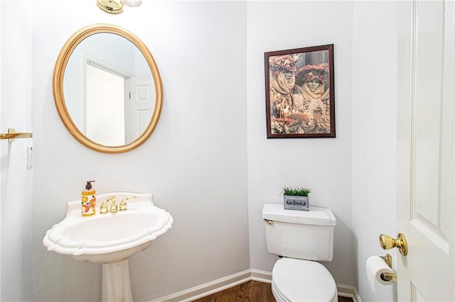 200 Ridge Bluff Ln, Suwanee, GA 30024 - bathroom with toilet, baseboards, and wood finished floors