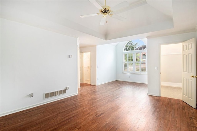 200 Ridge Bluff Ln, Suwanee, GA 30024 - empty room with wood finished floors, ceiling fan, a tray ceiling, and baseboards
