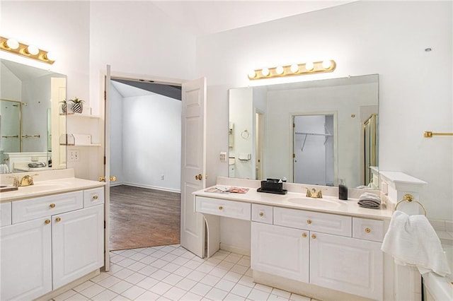 200 Ridge Bluff Ln, Suwanee, GA 30024 - bathroom with two vanities and tile patterned floors