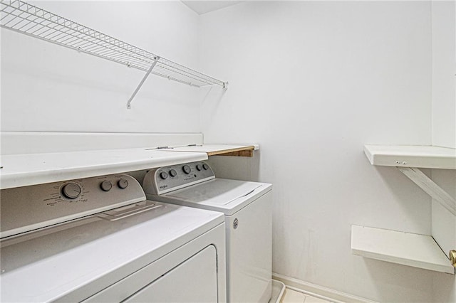 200 Ridge Bluff Ln, Suwanee, GA 30024 - washroom with washer and clothes dryer and baseboards