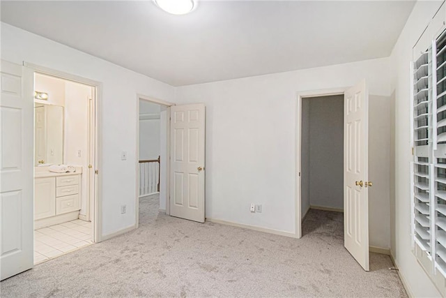 200 Ridge Bluff Ln, Suwanee, GA 30024 - unfurnished bedroom featuring light carpet, connected bathroom, and baseboards