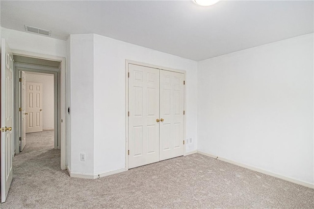 200 Ridge Bluff Ln, Suwanee, GA 30024 - unfurnished bedroom featuring carpet, baseboards, and a closet