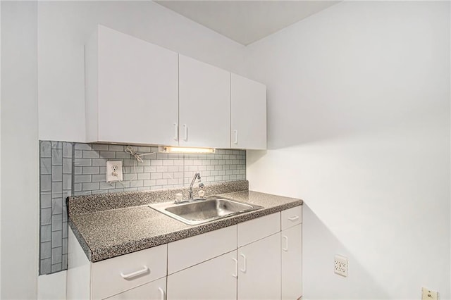 200 Ridge Bluff Ln, Suwanee, GA 30024 - kitchen with a sink, white cabinets, decorative backsplash, and dark countertops