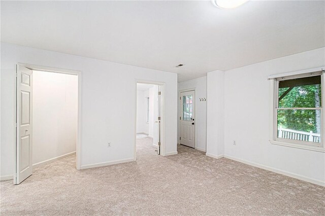200 Ridge Bluff Ln, Suwanee, GA 30024 - unfurnished bedroom with carpet floors, multiple windows, and baseboards