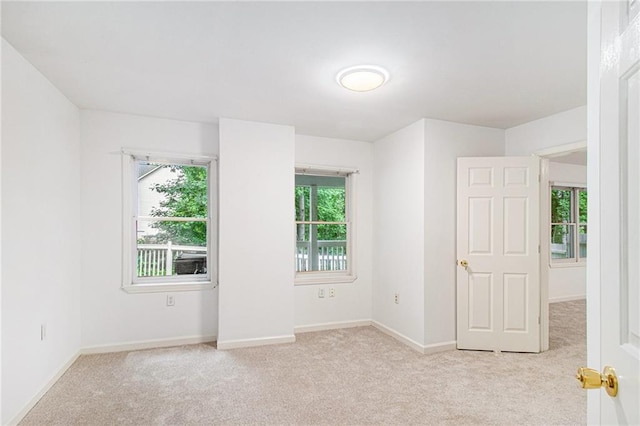 200 Ridge Bluff Ln, Suwanee, GA 30024 - empty room featuring light colored carpet and baseboards