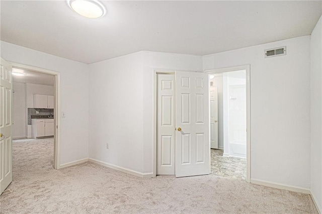 200 Ridge Bluff Ln, Suwanee, GA 30024 - unfurnished bedroom featuring carpet floors, baseboards, and a closet