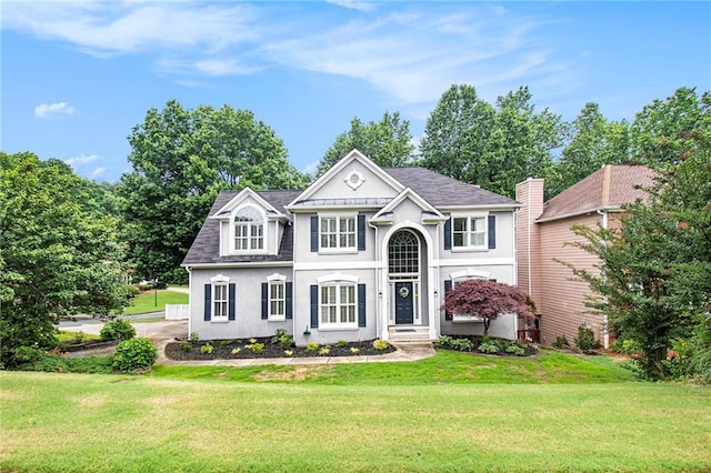 200 Ridge Bluff Ln, Suwanee, GA 30024 - view of front of property with stucco siding, a front yard, and roof with shingles