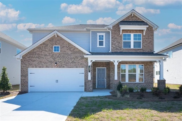 craftsman inspired home featuring brick siding, a front lawn, a porch, concrete driveway, and an attached garage