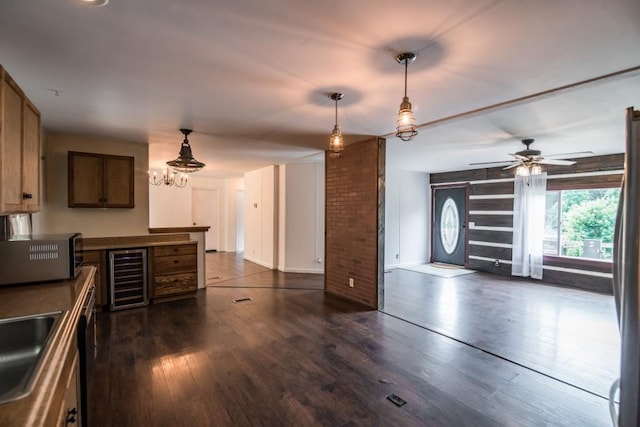 1530 Unity Church Cir, Maysville, GA 30558 - kitchen featuring wine cooler, dark wood-style flooring, a chandelier, and pendant lighting