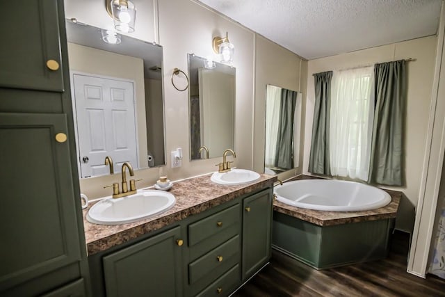 1530 Unity Church Cir, Maysville, GA 30558 - full bath featuring double vanity, a textured ceiling, a bath, and wood finished floors