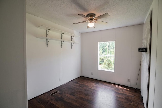 1530 Unity Church Cir, Maysville, GA 30558 - spare room with ceiling fan, dark wood-type flooring, and a textured ceiling
