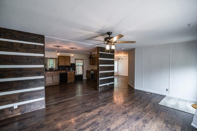 1530 Unity Church Cir, Maysville, GA 30558 - unfurnished living room featuring a chandelier, a ceiling fan, and dark wood-style flooring