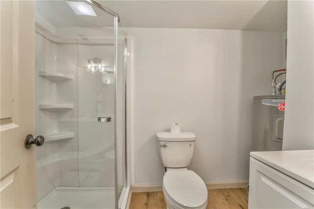 full bathroom with a shower stall, toilet, and wood finished floors