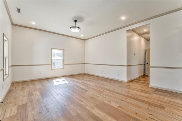 empty room featuring recessed lighting, light wood-style floors, visible vents, and baseboards