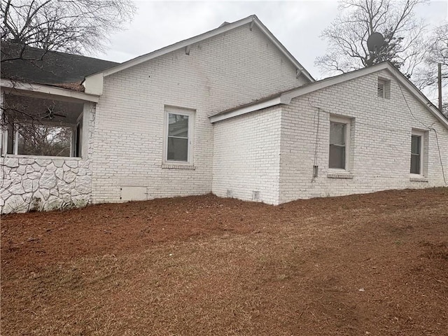 view of home's exterior with a lawn