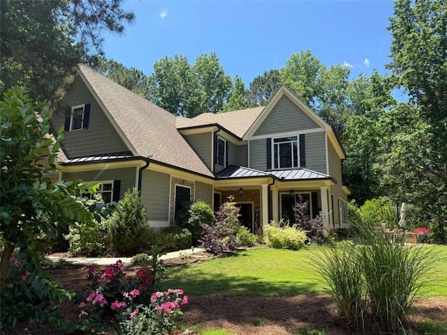 1323 Frey Lake Ct, Kennesaw, GA 30144 - view of front of home featuring a standing seam roof, roof with shingles, a front yard, and metal roof
