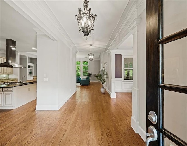 1323 Frey Lake Ct, Kennesaw, GA 30144 - entryway featuring a chandelier, light wood-style flooring, and ornamental molding