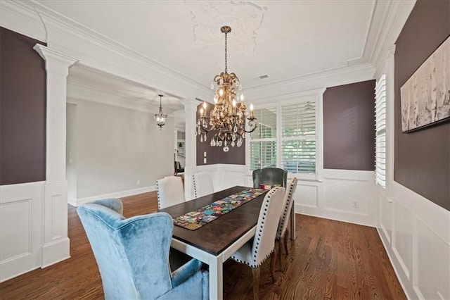 1323 Frey Lake Ct, Kennesaw, GA 30144 - dining space with a chandelier, a wainscoted wall, wood finished floors, ornate columns, and a decorative wall