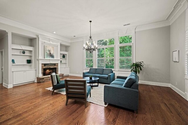 1323 Frey Lake Ct, Kennesaw, GA 30144 - living room with crown molding, baseboards, wood finished floors, a stone fireplace, and built in shelves