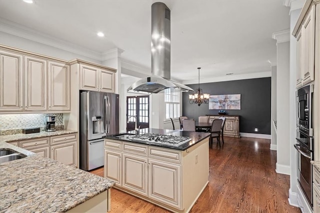 1323 Frey Lake Ct, Kennesaw, GA 30144 - kitchen featuring island exhaust hood, cream cabinets, stainless steel appliances, a sink, and a chandelier