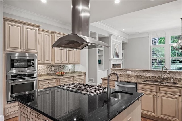 1323 Frey Lake Ct, Kennesaw, GA 30144 - kitchen featuring appliances with stainless steel finishes, island range hood, a sink, cream cabinets, and dark stone countertops