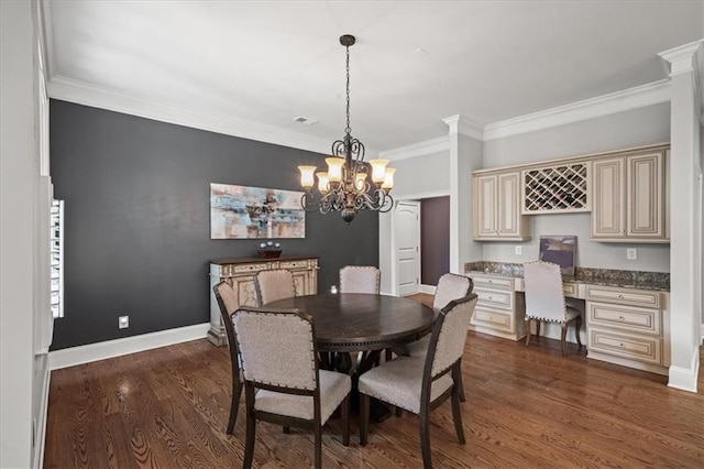 1323 Frey Lake Ct, Kennesaw, GA 30144 - dining area with crown molding, dark wood-type flooring, a chandelier, and baseboards