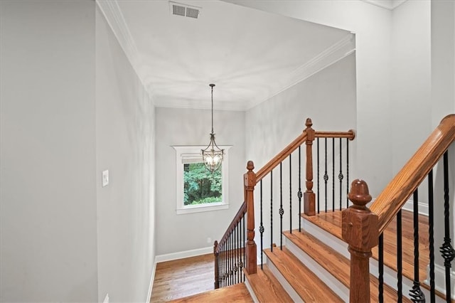 1323 Frey Lake Ct, Kennesaw, GA 30144 - staircase featuring a chandelier, wood finished floors, baseboards, and ornamental molding