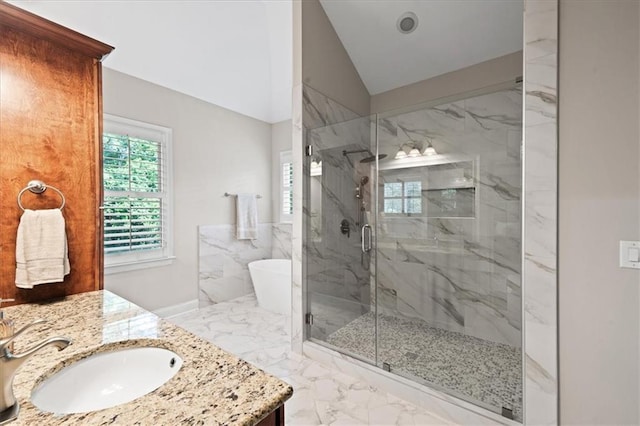 1323 Frey Lake Ct, Kennesaw, GA 30144 - bathroom featuring marble tiled flooring, a marble finish shower, vanity, a freestanding tub, and vaulted ceiling