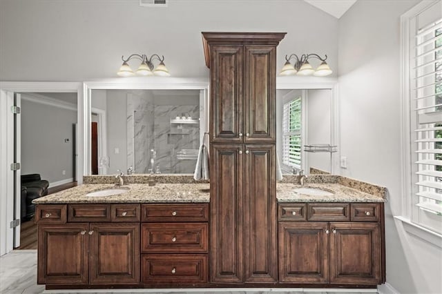 1323 Frey Lake Ct, Kennesaw, GA 30144 - bathroom with double vanity, a marble finish shower, plenty of natural light, and vaulted ceiling