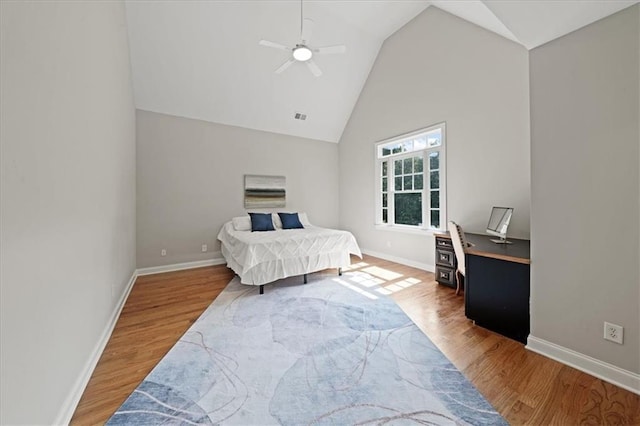 1323 Frey Lake Ct, Kennesaw, GA 30144 - bedroom with wood finished floors, high vaulted ceiling, baseboards, and ceiling fan