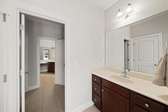 1323 Frey Lake Ct, Kennesaw, GA 30144 - bathroom featuring tile patterned flooring, vanity, and baseboards