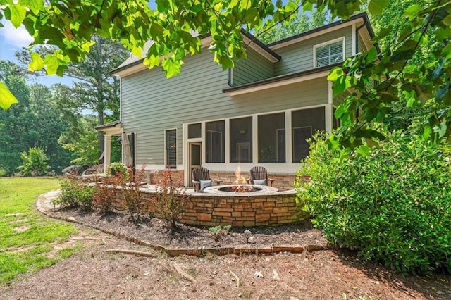 1323 Frey Lake Ct, Kennesaw, GA 30144 - back of property with a fire pit and a sunroom