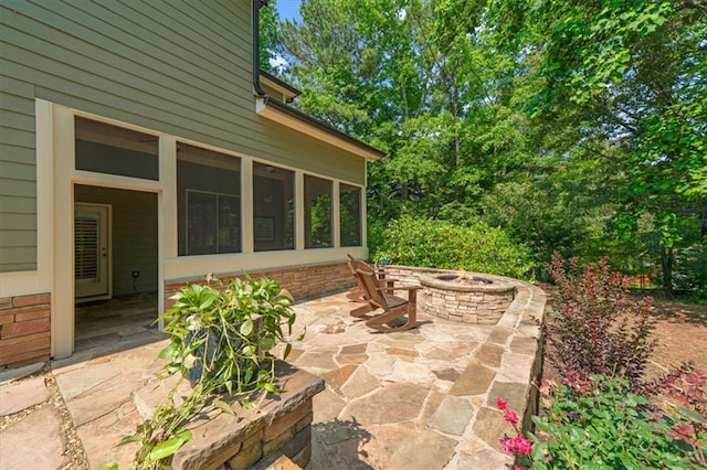 1323 Frey Lake Ct, Kennesaw, GA 30144 - view of patio / terrace with an outdoor fire pit and a sunroom