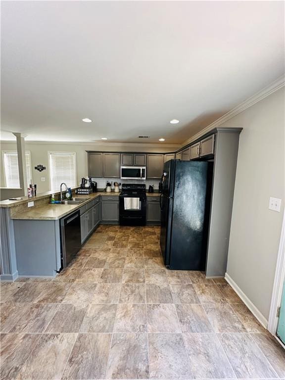 kitchen featuring black appliances, gray cabinets, crown molding, and sink