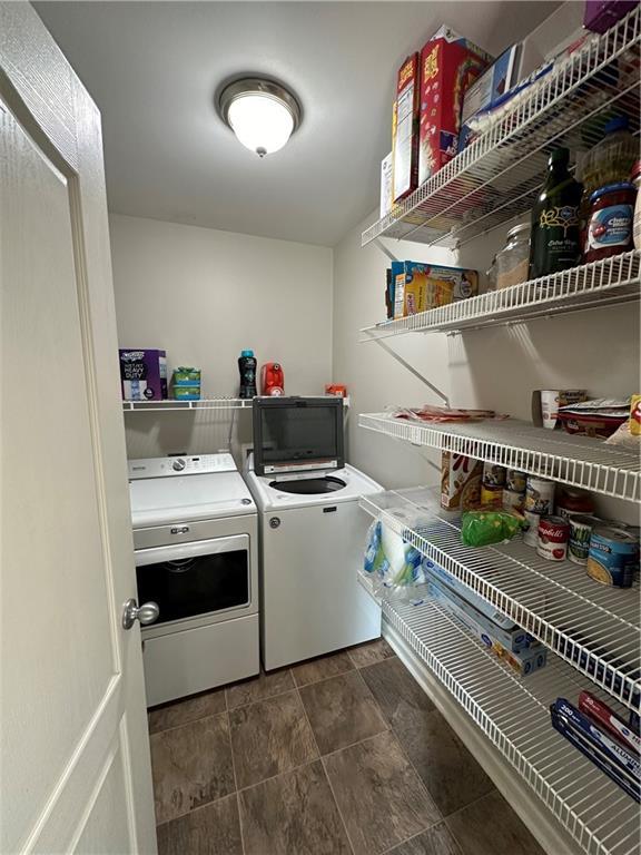 laundry area featuring washing machine and clothes dryer