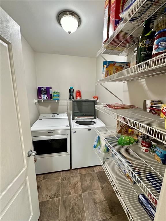 washroom featuring independent washer and dryer