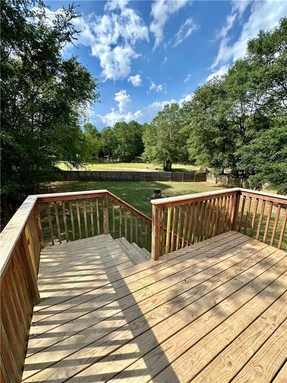 wooden terrace with a yard